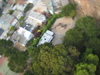 More surrounding houses and trees.